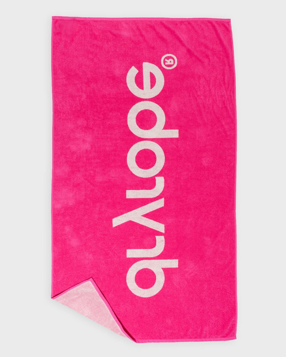 Dryrobe Strandtuch in Neonpink mit weißem Logo, Frottee-Material, zusammengefaltete Ansicht