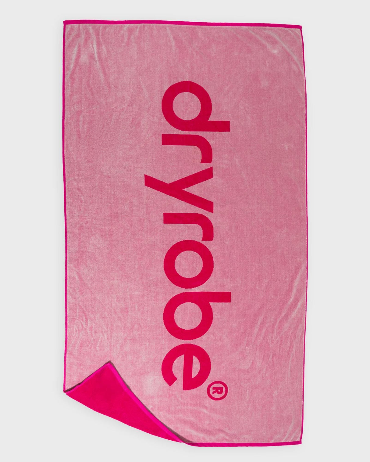 Dryrobe Strandtuch rosa mit Dryrobe-Logo, Baumwollmischgewebe, zusammengefaltet präsentiert