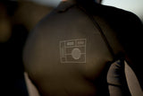 ION Neo Zip Top 2/1 LS Skin 2026, schwarzer Neoprenanzug mit Reißverschluss, Frontalansicht
