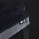 ION Collision Vest Element Side Zip 2026 schwarz-grau, Detailaufnahme Kante mit Logo und Reißverschluss