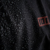 ION Collision Vest Element Side Zip 2026, schwarz, Detailaufnahme wasserabweisendes Material mit ION-Logo