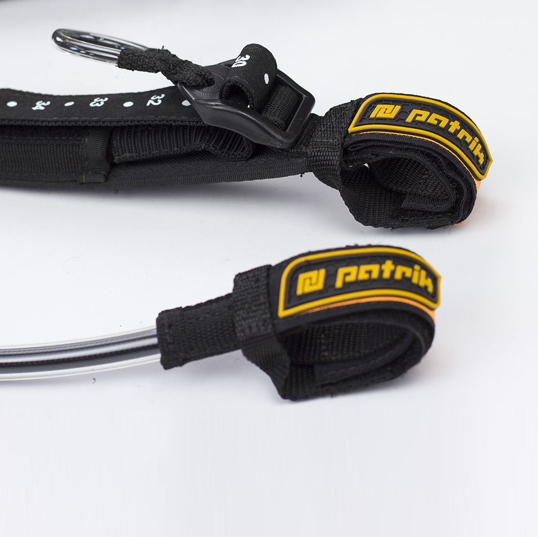 Patrik Harness Line Vario Kite-Trapezgurt, schwarzes Neopren mit gelben Patrik-Logos, verstellbar, Draufsicht-Detail