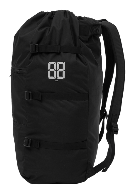 Mystic Compression Bag Kite 2027, schwarzer Kompressionsbeutel mit Kordelzug, reflektierendem Logo und Schulterriemen